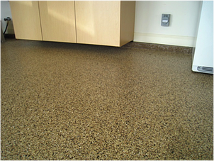 A decorative chip, polyaspartic polyurea garage floor coating.