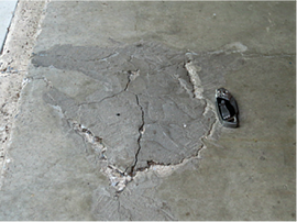 Damaged concrete in Harrisburg, PA garage floor