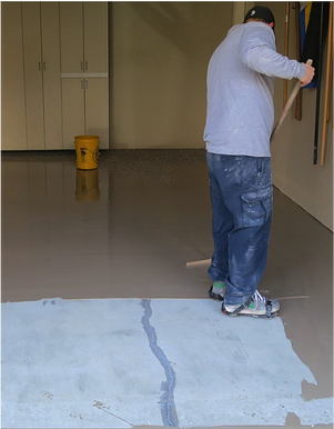 Mechanicsburg garage receives epoxy coatings by Stronghold Floors.