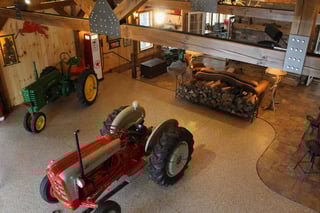 A tractor sitting on our decorative chip, epoxy floor coatings.