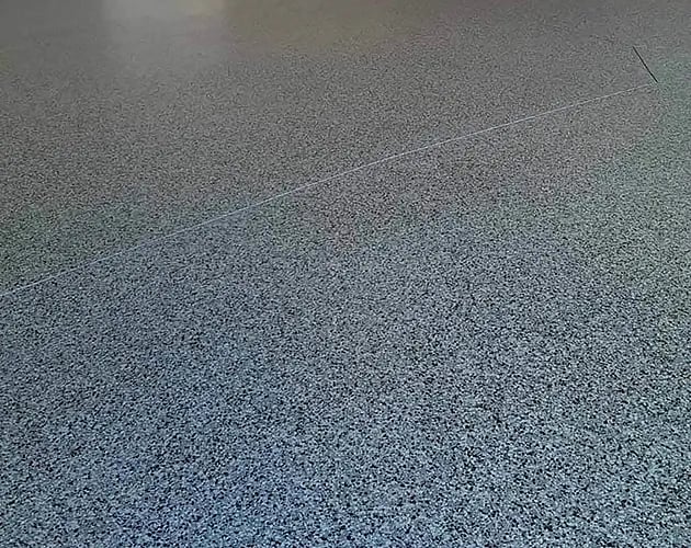 decorative-chip-epoxy-polyaspartic-garage-floor-630x500