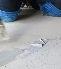 The second step for garage floor coatings is concrete surface repairs