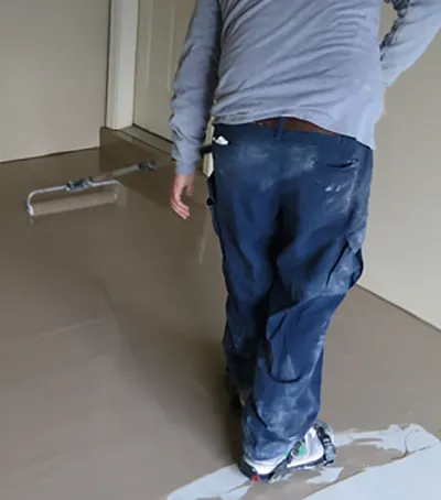 After surface prep and repairs, we coat the garage floor surface