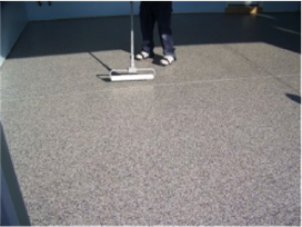 Professional installer applying the clear coat of polyurea