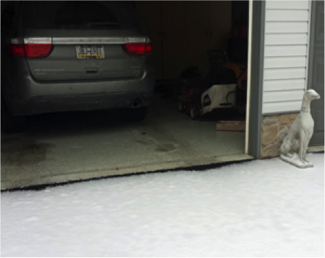 Despite the snow, we're still able to apply our professional floor coatings to this garage!